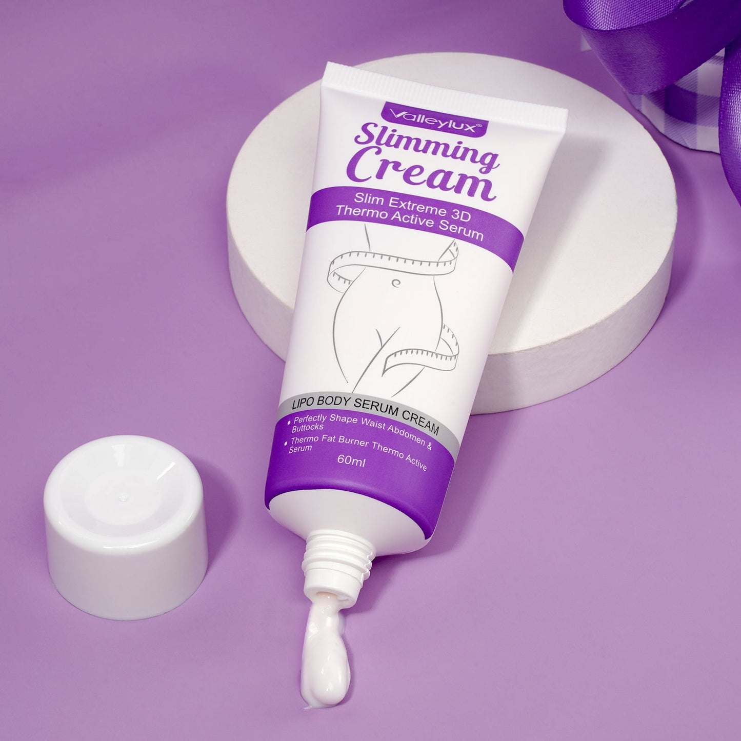 Tube of Valleylux Slimming Cream on a purple background