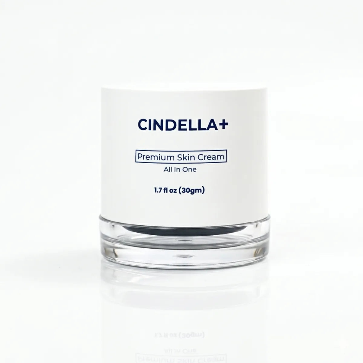 CINDELLA+ Premium Skin Cream in a clear glass jar with a white label, set against a clean white background with a soft reflection.
